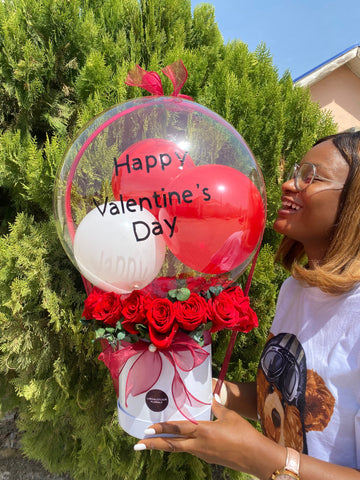 BOX OF ROSES AND A BALLON